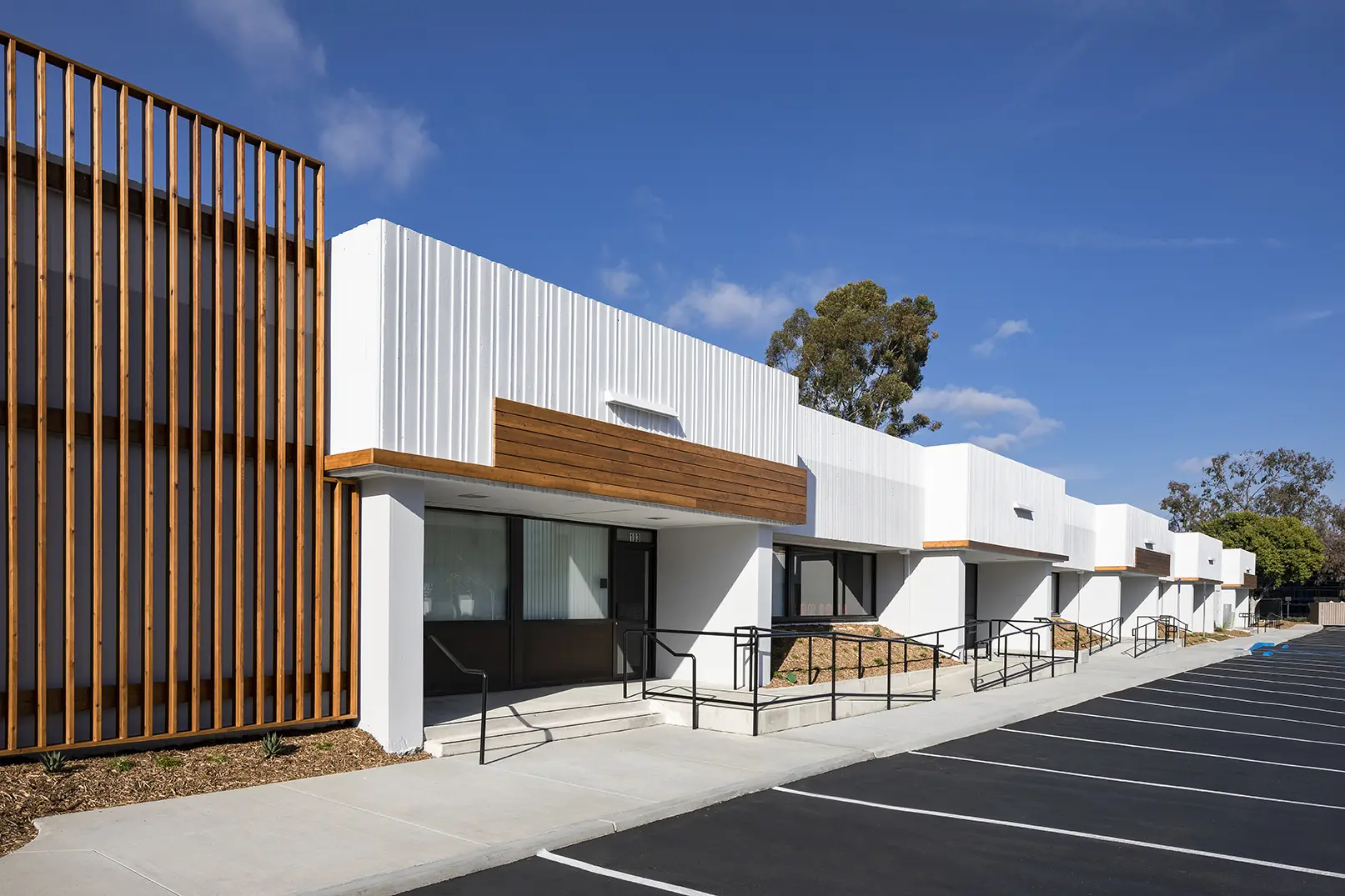 A building with a parking lot in front of it