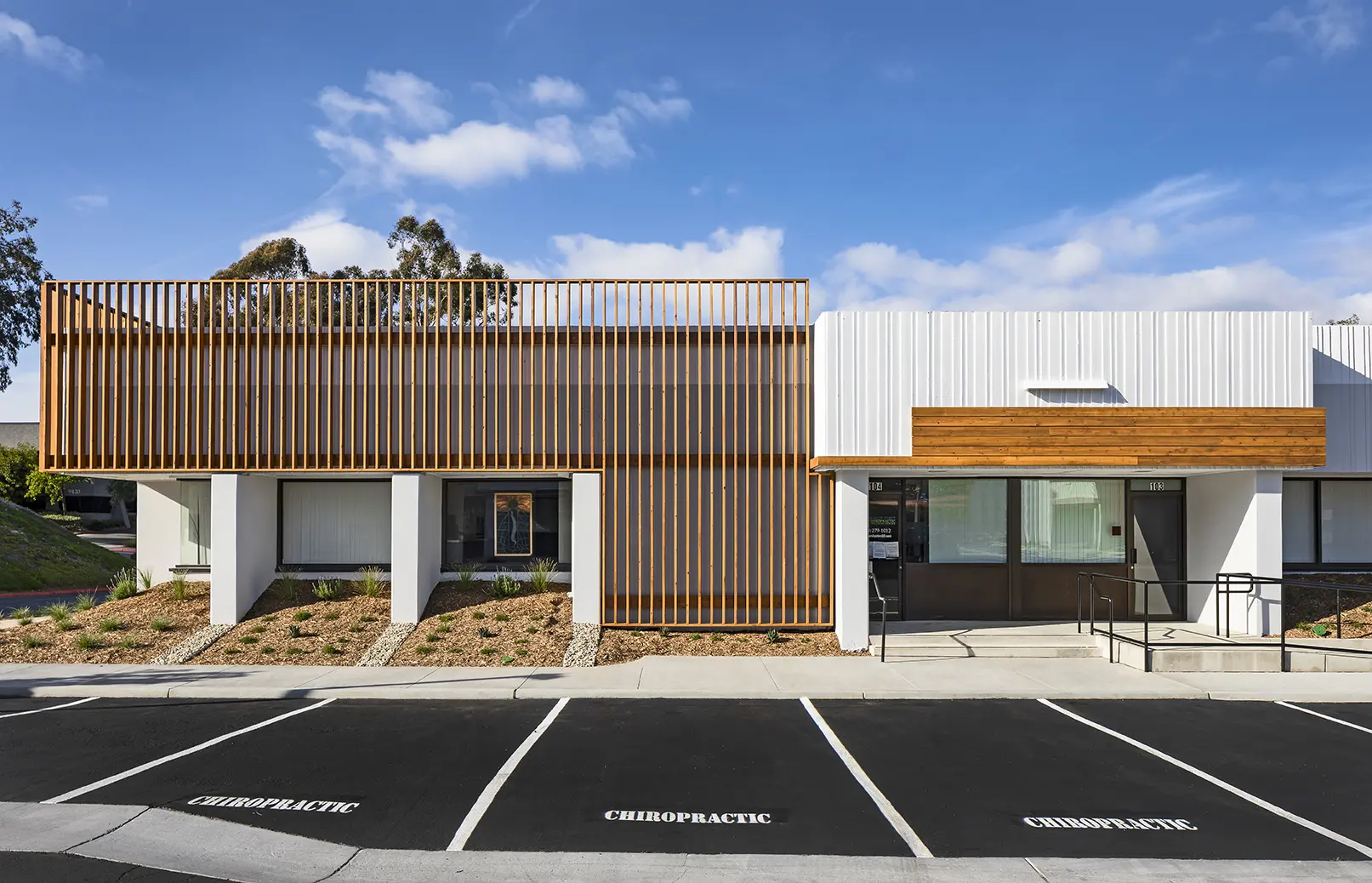 A building with a parking lot in front of it