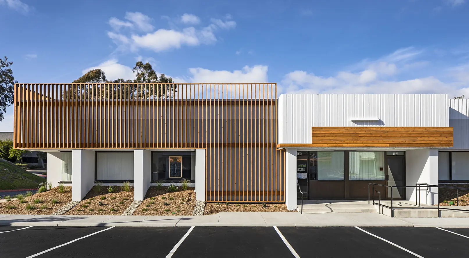 A building with a wooden fence on the side of it.