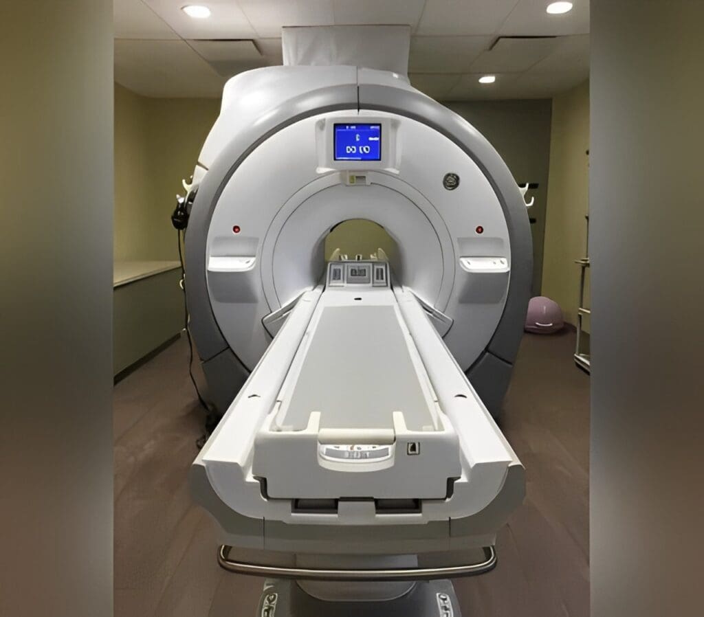 A mri machine in a room with lights on.