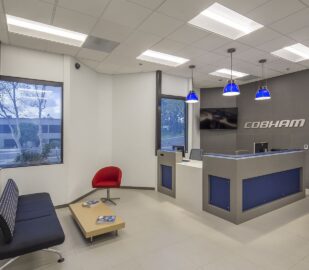 A reception area with blue and white walls.